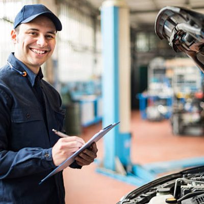 Portrait of a mechanic at work in his garage